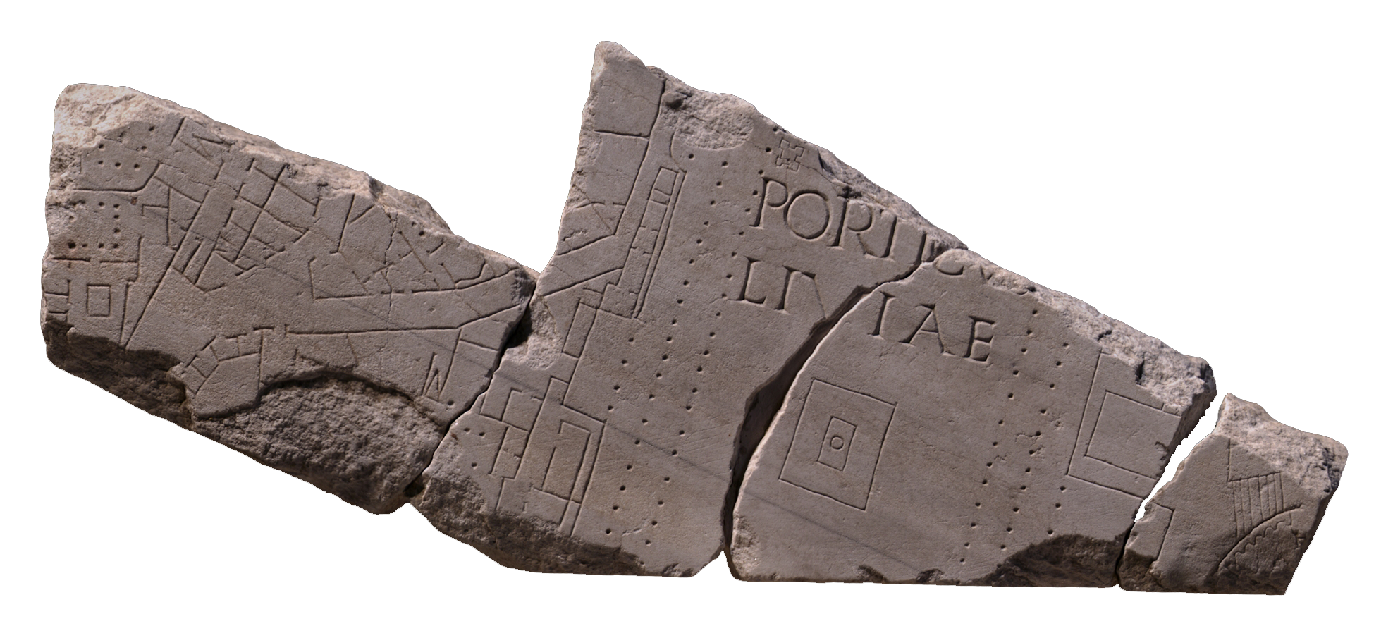 Broken stone fragments of the forma urbis. You can see the lines of roads and buildings marked on them